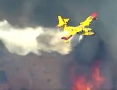 لقطات جوية لاستخدام طائرات فى إطفاء حرائق الغابات بكاليفورنيا.. فيديو