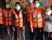 متطوعون شباب يعقمون لجان انتخابات مجلس النواب بشمال سيناء.. صور