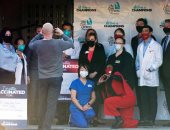 صور.. أفراد الفرق الطبية فى واشنطن يتلقون لقاح كورونا