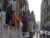 رفع إشغالات بشوارع الجيزة خلال حملات على الأحياء.. صور