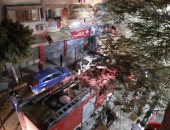 إخماد حريق بمخزن أسفل برج سكنى فى السويس.. صور