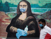 الموناليزا ومارلين مونرو وتمثال الحرية بالكمامة والكُحل على أسوار الهند.. صور