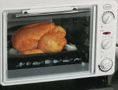 "تنظيم الكهرباء" ينصح باستخدام الميكروويف بدلا من الفرن لخفض قيمة الفاتورة