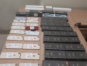 جمارك مطار القاهرة تضبط محاولتى تهريب 2 سلاح أبيض وعدد من الهواتف المحمولة