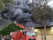 10 سيارات إطفاء للسيطرة على حريق مصنع أحذية فى بورسعيد.. صور