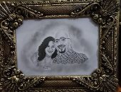 "رفيق" من المنيا يشارك موهبته فى رسم البورتريهات بالقلم الرصاص