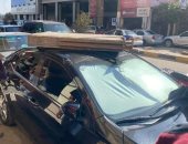 سقوط لوحة إعلانية على سيارة بسبب شدة الرياح فى حى الشرق ببورسعيد