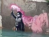 إيطاليا تعلن ترميم لوحة "الطفل المهاجر" لفنان الشارع بانكسى بعد تعرضها للضرر