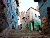 غزة فى القلب.. "معتز" رسم جرافيتى عن فلسطين بأحد شوارع الدرب الأحمر