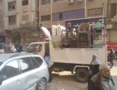 حملات لرفع تعديات المحال والباعة الجائلين بالشوارع التجارية فى بولاق الدكرور