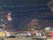 كرنفال زينة وأعلام فلسطين تكسو شارع الطيب بالأقصر.. استمتع بأجواء رمضان ليلاً