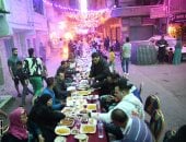 إفطار فيصل.. المئات ينظمون حفل إفطار جماعى بالجيزة