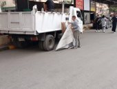 رفع إشغالات للباعة الجائلين والمنشآت التجارية خلال حملات فى الدقى