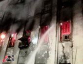 استكمال عمليات تبريد حريق سنترال رمسيس.. صور
