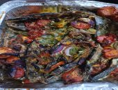 رمز المائدة الدمياطية.. صينية السمك السنجارى طبق أصيل يحمل نكهة البحر