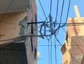 أهالى شارع فى حى الهرم يشكون تدلى الأسلاك الكهربائية: تعرض حياتنا للخطر