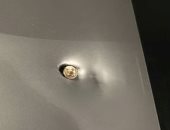 رصاصة تستقر فى حاسوب رجل أعمال صينى بعد نجاته من سطو مسلح فى البرازيل