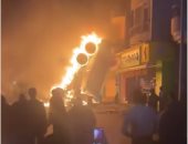 ننشر صور حريق سيارة تريلا امتد لعقار سكنى عقب سقوطها من أعلى دائرى الطالبية