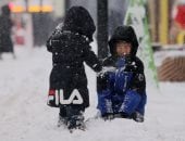 التساقط الطبيعى للثلوج يداعب مدينة الجليد العالمية فى الصين