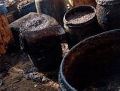 ضبط مكان عشوائى لتجميع الزيوت المعدنية بغرض إعادة تدويرها بالفيوم