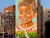 على ومها.. قصة حب وفن يزين شوارع أسوان بالجداريات.. صور