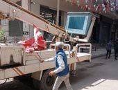 حى العجوزة يشن حملة لإزالة الإعلانات المخالفة بشارع ترعة الزمر بأرض اللواء