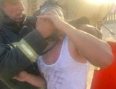 الحماية المدنية تنقذ شخصا وسيدة من حريق شقة فى جسر السويس ..صور