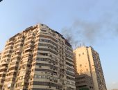 إخماد حريق داخل شقة سكنية فى الدقى دون إصابات.. صور وفيديو