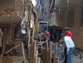 استجابة للشكاوى.. حى العجوزة يرفع تجمع صرف صحى بشارع أحمد السباك فى أرض اللواء