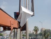 إزالة إعلانات غير مرخصة فى حملة بحى العجوزة.. صور