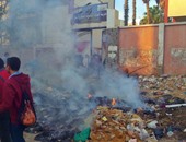 بالصور.. طلاب مدرسة الثانوية العسكرية بإمبابة يشتكون من حريق القمامة