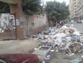قارئ بقرية اكراش بالشرقية يستغيث من تلال القمامة