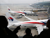 عائلات الصينيين المفقودين بطائرة ماليزيا المنكوبة يحتشدون للاحتجاج