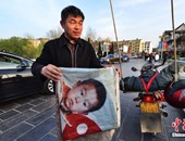 بالصور..صينى يسير 400ألف كيلو متر على مدار 18عاما ليبحث عن طفله الضائع