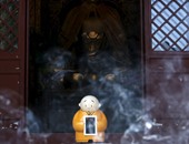 بالصور.. معبد بوذى صينى يطور أول روبوت "رجل دين" فى العالم
