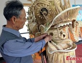 فنان صينى يشكل "تنين" من 83 ألف قطعة قش.. والحكومة تعتمده خبيرا