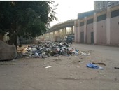 انتشار القمامة فى الشارع الواصل بين محطتى مترو عزبة النخل والمرج القديمة