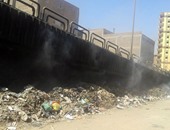 بالصور.. القمامة المشتعلة تتسبب فى انتشار الأمراض بشارع المطاحن فى بشتيل