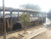 ننشر صور حرق ملثمين أتوبيسا لنقل عاملى"النقل العام" بحلوان