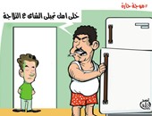 مواطن يتناول "الشاى" داخل الثلاجة.. فى كاريكاتير اليوم السابع