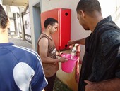 بالصور.. طلاب بنى سويف يشربون من خراطيم المطافئ بمعسكر شكشوك فى الفيوم