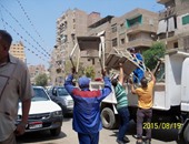 بالصور.. حى دار السلام والمرافق يشنان حملة لإزالة الإشغالات بشارع الفيوم