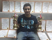 "باسم" أصغر بطل فى رياضة "سباق الحمام الزاجل"