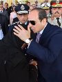 الرئيس السيسى يقبل رأس والدة الشهيد عمر الرئيس السيسى يقبل رأس والدة الشهيد عمر