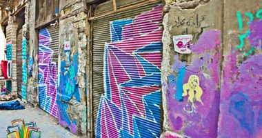 بالصور.."السعادة بالألوان".. إبداعات شبابية على جدران المناطق الشعبية