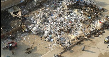 "صحافة المواطن".. تراكم القمامة بشارع الترولى بالمطرية