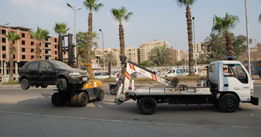 حملة لرفع السيارات المتهالكة من شوارع وميادين الجيزة