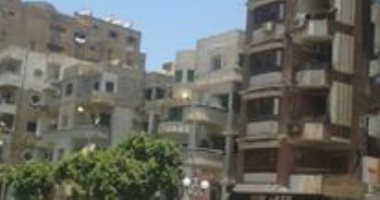 أعمدة الكهرباء مضاءة نهاراً بشارع الجمهورية بسوهاج