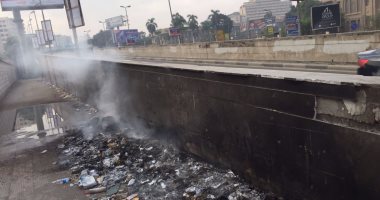 بالصور.. قارئ يرصد حرق القمامة بجوار سور "المصل واللقاح" فى المهندسين