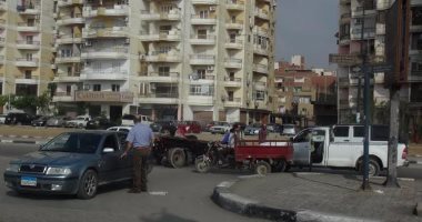 بالصور.. سائق "كارو" يعتدى على سيدة بالسويس ويتسبب فى أزمة مرورية